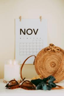 shallow focus photo of calendar mounted on white wall by Maddi Bazzocco courtesy of Unsplash.