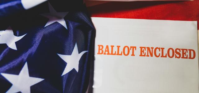 a close up of a piece of paper on a flag by Joshua Woroniecki courtesy of Unsplash.